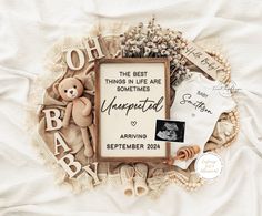 a baby announcement with teddy bears and other items arranged in the shape of a frame