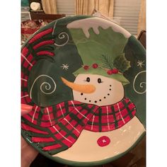 a plate with a snowman painted on it