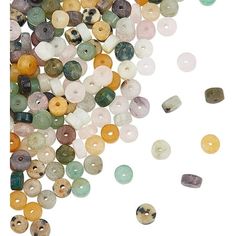 many different colored beads on a white background