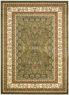 a green and beige rug with an ornate design on the center, surrounded by flowers