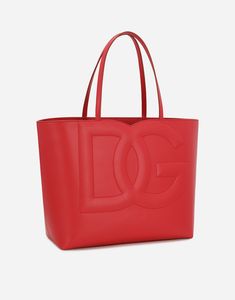 Medium calfskin DG logo shopper: Red Calfskin top handles Printed fabric lining featuring a zipped pocket and flat pocket Item comes with a branded dust bag Measurements: 30 x 35 x 14 cm Made in Italy Dg Logo, Printed Fabric, Womens Tote, Logo Branding, Red Leather, Calf Skin, Tote Bags, Dolce And Gabbana, Printing On Fabric