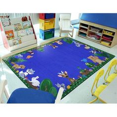 a child's play area with toys and bookshelves in the background, including a blue rug that has animals on it