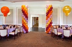 an elegant dining room decorated with balloons and tables