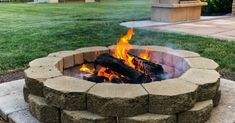 a fire pit in the middle of a yard