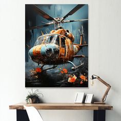 an orange and blue helicopter with flowers on it