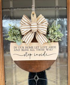 a wooden sign that says in our home let love abide and bliss all those who step inside