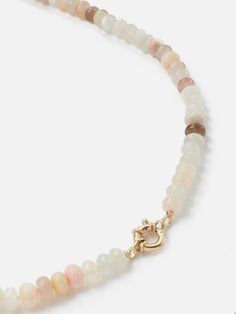 The Encirkled Cashmere Ombre Gemstone Necklace is perfect for everyday and includes a 14k yellow gold spring ring clasp that is perfect for holding your favorite charms. Assorted 8mm gemstones that may include agate, aventurine, chocolate moonstone, peach moonstone, Peruvian opal, rainbow moonstone, rutilated quartz, rose quartz, selenite, and strawberry quartz Gemstone card comes with each necklace with list of included gemstones 12mm 14k yellow gold spring ring clasp Each piece is unique and m Single Strand Agate Jewelry Gift, Single Strand Agate Round Necklace, Everyday Jewelry With Oval Natural Stones, Single Strand Round Agate Necklace, Everyday Oval Jewelry With Natural Stones, Sunstone Jewelry With Round Natural Stones, Everyday Oval Natural Stone Jewelry, Yellow Gold Jewelry With Gemstone Round Beads, Elegant Sunstone Jewelry, Round Shape