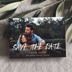 save the date card with an image of a man and woman on it, surrounded by greenery