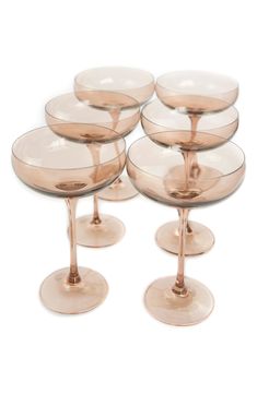 six champagne glasses sitting on top of each other