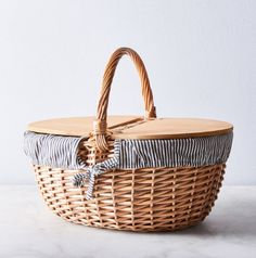 a wicker basket sitting on top of a table