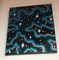 a black and blue painting on the wall with stars in the night sky above it