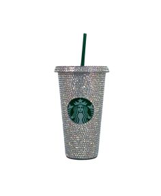 a starbucks cup with a green straw in it