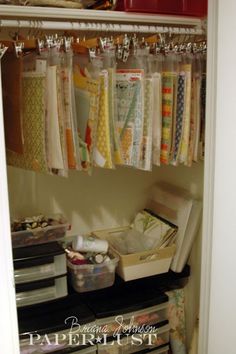 the closet is full of quilts and other crafting supplies, including fabric samples