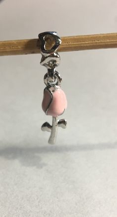 Pink Stemmed Rose Flower Spacer Dangle Charm Bead fits Pandora and European Bracelets Fits all European Charm Bracelets and necklace too Please ask any questions as I do not accept returns ! Thank You for taking the time to visit my store ! Pink Dangle Jewelry With Rose Design, Pink Rose Design Dangle Jewelry, Pink Flower Charm Dangle Jewelry, Pink Flower Pendant Jewelry With Rose Design, Rose Colored Dangle Jewelry With Rose Design, Pink Adjustable Dangle Charms, Pink Dangling Charms For Mother's Day, Pink Flower Pendant Jewelry With Charms, Pink Rose Pendant Jewelry