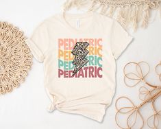 "ABOUT OUR Pediatric Cheetah lightning Bolt Shirt - 100% Airlume combed and ringspun cotton  - Soft cotton and quality print make users fall in love with it over and over again.  - These t-shirts have-ribbed knit collars to bolster shaping.  - Printed and shipped from the USA CARE INSTRUCTIONS -  Wash inside out with like colors.  - Tumble dry or hang to dry. -  Try not to iron directly over the design. Iron if necessary!  HOW TO ORDER Cheetah lightning Bolt Shirt 1) Please, check and review all photos  2) Choose your sweatshirt or t-shirt style, color, and size  3) Click add to cart. You can go back and follow the same steps to add more items to your cart  4) Click \"Proceed to check out\"  5) Add your shipping address and choose your shipping method. (PLEASE check your current address.) Lightning Shirt, Leopard Lightning Bolt, Animal Print Shirt, Pediatric Nurse, Animal Print Shirts, Pediatric Nursing, Nurse Shirt, Nursing Shirts, Lightning Bolt