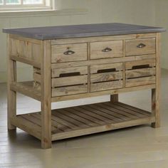 a wooden table with drawers on top of it and a window in the back ground