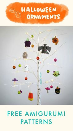 a tree with halloween ornaments hanging from it