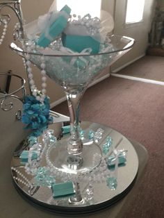 a martini glass with blue and white decorations