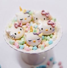 hello kitty candies in a white bowl on a table