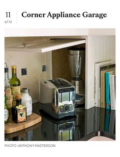 an appliance garage is shown with bottles on the counter and in front of it