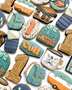 cookies decorated like cars, trucks and campers are arranged in the shape of letters