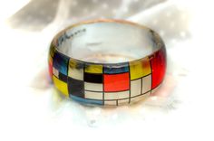 Mondrian Resin Bangle, Famous Art Jewelry, Resin Bracelet Mondrian Born 7 March 1872 - Died 1 February 1944 (aged 71) Middle design thick bangle - Height of the bangle - 3cm/1.18inches Pieter Cornelis Mondrian was a famous abstract Cubism painter, born in the Netherlands. His most recognized works are abstract paintings of colored squares, rectangles, and thick black lines.We love his minimal art , and that's why we decided to create a bracelet with his design in red, yellow, white and blue squa Artsy Multicolor Bangle Bracelets, Multicolor Wearable Art Bangle Bracelets, Multicolor Bangle Bracelets In Wearable Art Style, Artistic Multicolor Bangle Bracelet, Artistic Multicolor Cuff Bracelet As Gift, Artistic Multicolor Cuff Bracelet As A Gift, Artistic Multicolor Cuff Bracelet Gift, Abstract Cubism, 1 February