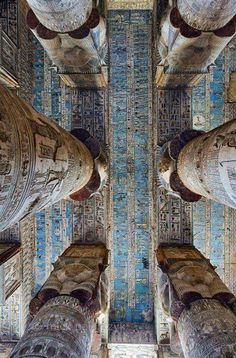 looking up at the ceiling in an ornately decorated room with columns and mosaic tiles