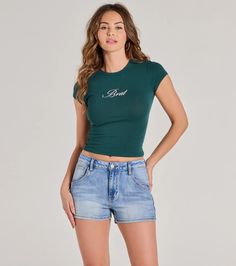 Channel the iconic brat aesthetic in this cute graphic tee featuring a crew neckline, short cap sleeves, a cursive script reading "Brat," and a fitted cropped hem. Style with cargo pants and sneakers for a trendy everyday 'fit.Fit & FeaturesStretchy cotton-blend fabricCrew necklineCap sleevesCursive script reads "Brat"Fitted cropped hemRuns true to size Casual Fitted Cropped T-shirt With Text Print, Cursive Script, Cropped Graphic Tees, Cute Graphic Tees, Charli Xcx, Cargo Pants, T Shirt Top, Cap Sleeves, Cotton Blend