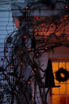 a house decorated with christmas lights and decorations