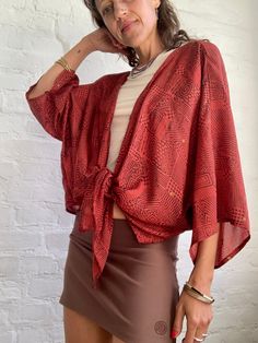 This is free size wrap tie waist blouse made in vintage silk  With wide kimono sleeves, very light, prefect for hot summer days over coat  Super stylish and comfy  MEASURE Free size MATERIAL *silk More trendy boho ideas at  https://www.etsy.com/shop/AltheaStores? Thank You for looking Chic Wrap Cover-up For Spring, Trendy Long Sleeve Summer Shrug, Summer Open Front Shrug, Chic Kimono With Tie Waist And Kimono Sleeves, Summer V-neck Shrug, Chic Long Sleeve Summer Shrug, Chic Vacation Blouse With Tie Waist, Chic V-neck Summer Shrug, Chic V-neck Shrug For Summer