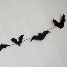 some bats are hanging on a string