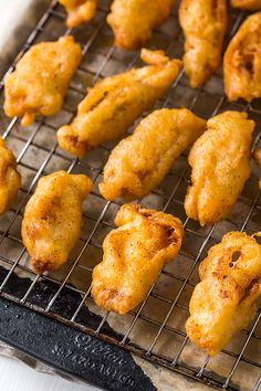 some fried food is on a metal rack