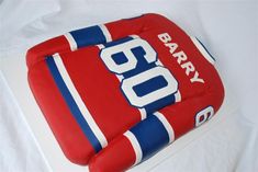 a birthday cake made to look like an ice hockey jersey