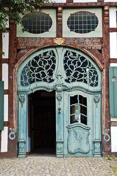 an old building with ornate doors and windows