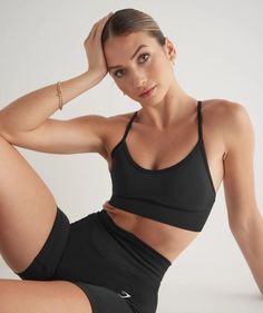 Gymshark Sweat Seamless Sports Bra - Black | Gymshark Comfortable Soft Touch Activewear For Sports, Fitted Sports Bra For Sports, Black Stretch Sports Bra With Soft Touch, Fitted Sports Bra With Soft Touch, Athleisure Sports Bra With Soft Touch For Gym, Sporty Activewear With Medium Support And Soft Touch, Micro-elastic Soft Touch Sports Bra For Workout, Sporty Soft Touch Sports Bra For Workout, Sporty Soft Touch Activewear For Sports