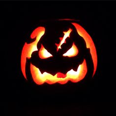 a carved jack o lantern in the dark