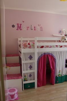 a child's bedroom with pink walls and white bunk beds, wooden flooring