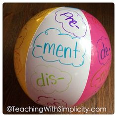 a colorful beach ball with writing on it