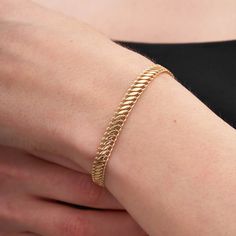 The snake link chain gives this bracelet a smooth feel, making it perfect for women who love the simplicity. It also adds a touch of elegance and sophistication. This bracelet is also available in white and rose gold, so you can choose the color that best suits your style. Product Details * 14K Real Gold * Yellow Gold - White Gold - Rose Gold * Length: 17+2 cm * Lobster Claw Closure * Hypoallergenic * Model No B215323 14K Real Gold Handmade Snake Bracelet for Women, Herringbone Chain Bracelet Fe Gold Jubilee Bracelet With Snake Chain, Formal Jubilee Bracelet With Snake Chain, White Gold Bracelet Women, Latest Bracelet Designs Gold For Women, Gold Arm Band, Latest Bracelets, New Gold Jewellery Designs, Antique Jewellery Designs, Handmade Gold Jewellery