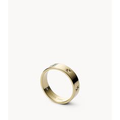 This band ring features gold-tone stainless steel. Fossil Ring, Thick Ring, Stamped Rings, نظارات شمسية, Ringe Gold, Summer Plans, Gold Band Ring, Station Necklace, Bright Gold