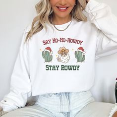 ⚡Yeehaw! Get into the holiday spirit with a unique twist with our Western Christmas Sweatshirt. This is not your typical holiday jumper, it's a unique piece of attire that features a fun and quirky Cowboy Santa design. It's the perfect top to wear to all your holiday parties, adding a touch of country charm to your festive outfits. If you're a fan of country music or know someone who is, this sweatshirt is an ideal gift that will bring a smile to their face and warmth to their holiday season. Ou Holiday Shirts Vinyl Western, Western Christmas Shirt Designs, Country Sweatshirts & Hoodies, Cowboy Christmas Shirt, Western Christmas Sweatshirt, Cowboy Santa, Festive Outfits, Country Fan, Funny Christmas Sweaters