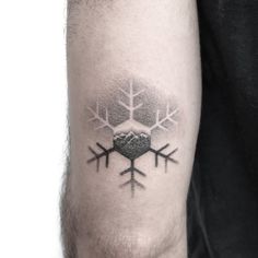 a man's arm with snowflakes on it