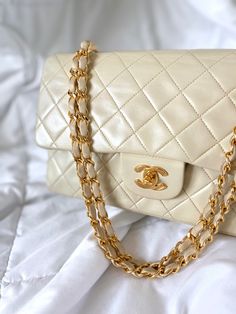 CONDITION:??¨GREAT d . . Bringing to the shop a stunning, soft classic cream Lambskin Chanel flap. Excellent investment piece that??¨can be loved for years to come. Vintage Chanel crafted in the 90's= 24k hardware and soft buttery lambskin. Don't miss out on this gorgeous find. Can be  as a long or short shoulder bag. Crafted between 1996-1997. Exact bag??¨currently going between $6k-$8k online! Please note: Bottom corners have very slight wear as pictured. Interior is clean. Hairline scratches on Turnlock. Beautiful gold hardware. Overall bag is in great condition!!??¨  Please review all pics and ask any questions prior to purchasing! To prevent any form of fraud, I??¨keep video records of??¨myself??¨packaging??¨and dropping off each order, and??¨all??¨orders ship with??¨tracking and??¨si Chanel Classic Medium, Girl Backpacks School, Chanel Model, Soft Classic, Bottega Veneta Shoulder Bag, Backpack Tote Bag, Girl Backpacks, Vuitton Bag, Vintage Chanel