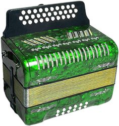 an old green accordion sitting on top of a white background