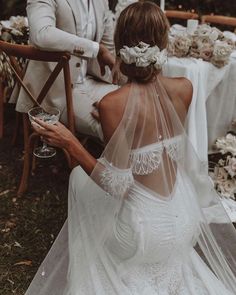 a bride and groom sitting at a table