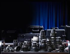 many different types of cameras sitting on a table