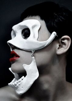 a woman with white mask and red lips