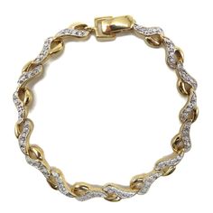 Crafted with elegance and sophistication, this Vintage Hi-Fashion Bracelet is a true statement piece. The stunning design features gleaming sterling silver intertwined with delicate diamond accents, exuding timeless beauty. The intricate craftsmanship and gold-plated finish add a touch of luxury to this exquisite bracelet. Perfect for adding a touch of glamour to any outfit, this piece is a versatile addition to your jewelry collection. ● The bracelet is 7" long  with a foldover clasp  ● Hallmar Vintage Diamond Bracelet, Roman Jewelry, Silver Tennis Bracelet, Silver Link Bracelet, Bracelet Diamond, Bead Bangles, Vintage Bracelet, Art Deco Earrings, Gold Plated Bracelets