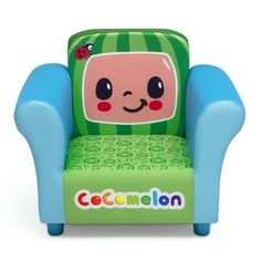 a green and blue children's chair with a cartoon character on the back, sitting in front of a white background