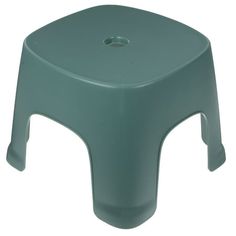 a green plastic stool on a white background